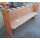 A 6' 10" pitch pine church pew - one end adapted