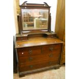 A 3' 6" Edwardian walnut dressing chest with swing mirror and flanking trinket drawers, over two