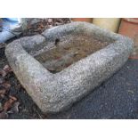 A 27" shallow granite trough with drain/inlet to side