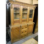 A 4' 10" late Victorian pitch pine dresser with two shelves enclosed by a pair of glazed cupboard