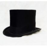 A vintage black top hat by W.H. Mitchell & Son