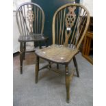Six wheel back kitchen chairs ranging in age from late 18th to 20th Century, most with elm seats,