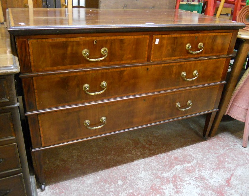 A 4' Regency style mahogany, strung and cross banded dressing chest of two short and two long