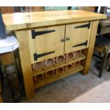 A 3' 6" polished hardwood kitchen unit with two door cupboard over a two tier terracotta pipe