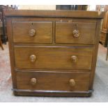 A 33 3/4" Victorian mahogany chest of two short and two long graduated drawers, set on bun feet