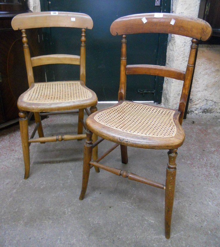 A pair of Victorian stained beech framed bedroom chairs with rattan seat panels