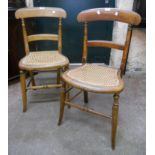 A pair of Victorian stained beech framed bedroom chairs with rattan seat panels