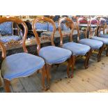 A set of six stained wood framed balloon back dining chairs with blue draylon upholstered seats, set