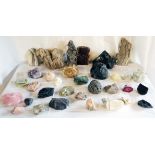 A collection of mineral specimens including iron pyrite, rose quartz, amethyst, onyx, obsidian,