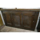 A 5' 5 1/2" antique mahogany slender cabinet with shelves enclosed by three panelled doors