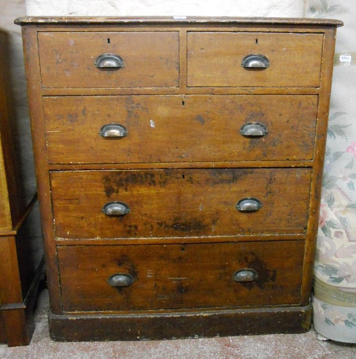 A 3' 6" Victorian stained and grained pine chest of two short and three long graduated drawers,