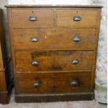 A 3' 6" Victorian stained and grained pine chest of two short and three long graduated drawers,