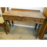 A 3' 6" early Victorian mahogany side table with two frieze drawers, set on turned, tapered and