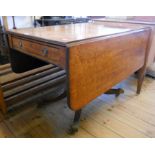 A 3' 6" 19th Century mahogany Pembroke table with single drawer and opposing dummy drawer, set on