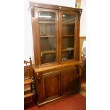 A 3' 5" Victorian mahogany two part cabinet with glazed top section over a chiffonier base with