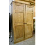 A 4' 4" Victorian satin walnut and pine larder cupboard, with shelves enclosed by a pair of panelled