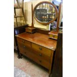 A 3' 6" Edwardian inlaid mahogany dressing table with bevelled oval mirror and flanking trinket