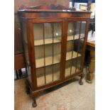A 36" 1920's mahogany bow front display cabinet with moulded top rail and gadrooned edge, material