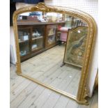 A 4' 8" ornate gilt framed dome top overmantel mirror