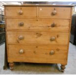A 3' 6" Victorian stripped pine chest of two short and three long graduated drawers, set on turned