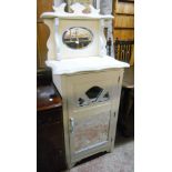 A painted wood washstand with bevelled oval mirror set raised back, serpentine top and shelves
