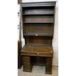 A 36" Victorian oak clerk's knee-hole bureau bookcase with three open shelves over slope enclosing a