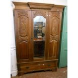 A 4' 2" Edwardian walnut wardrobe with break front moulded cornice, flanking carved panel decoration