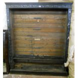 A 5' late Victorian stained oak open bookcase with carved decoration and remaining adjustable shelf,