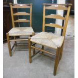 A pair of oak framed chapel chairs with woven rush seats