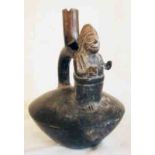 A pre-Columbian South American blackware pottery chimu vessel with figural spout decoration -