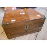 An antique walnut writing slop with brass corners and fitted interior
