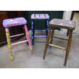 Seven school art department stools with solid seats and turned supports - six with student