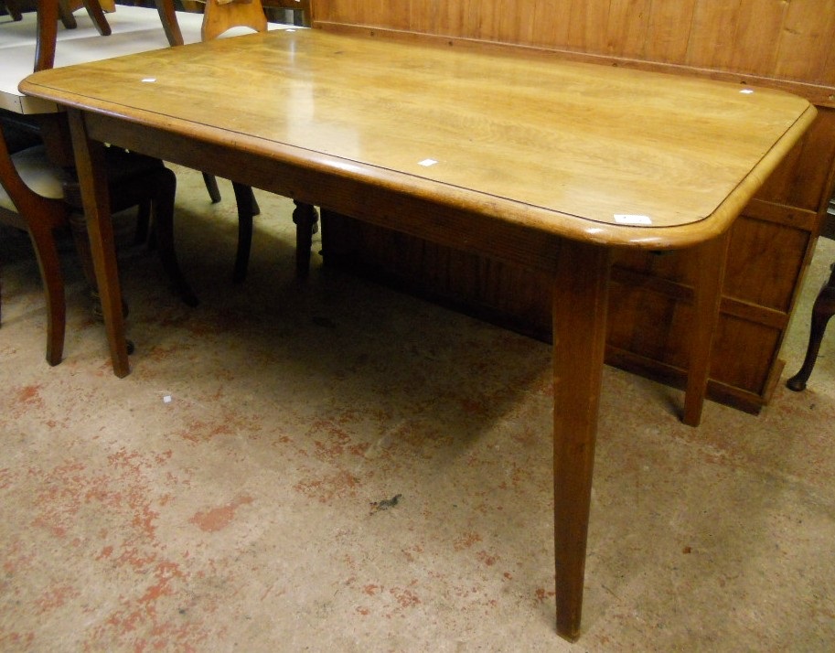 A 4' 7" Victorian sun bleached figured mahogany dining table top, set on a later base with square
