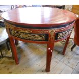 A 3' 11½" diameter Chinese lacquered dining table, comprising two D-end sections with decorative