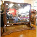 An early 19th Century mahogany framed dressing table mirror with flanking scroll supports and shaped
