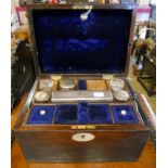 A 10¾" Victorian mahogany travelling toilet case with mother-of-pearl escutcheons, fitted interior