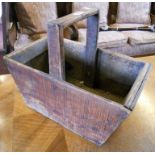 A vintage stained wood trug