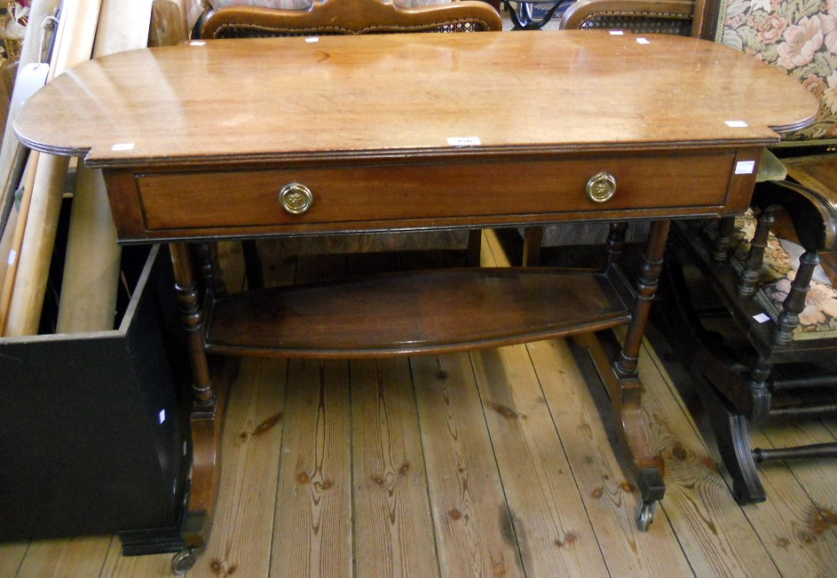 A 3' 9" late Georgian mahogany centre table with reeded edge and break curved ends, frieze drawer