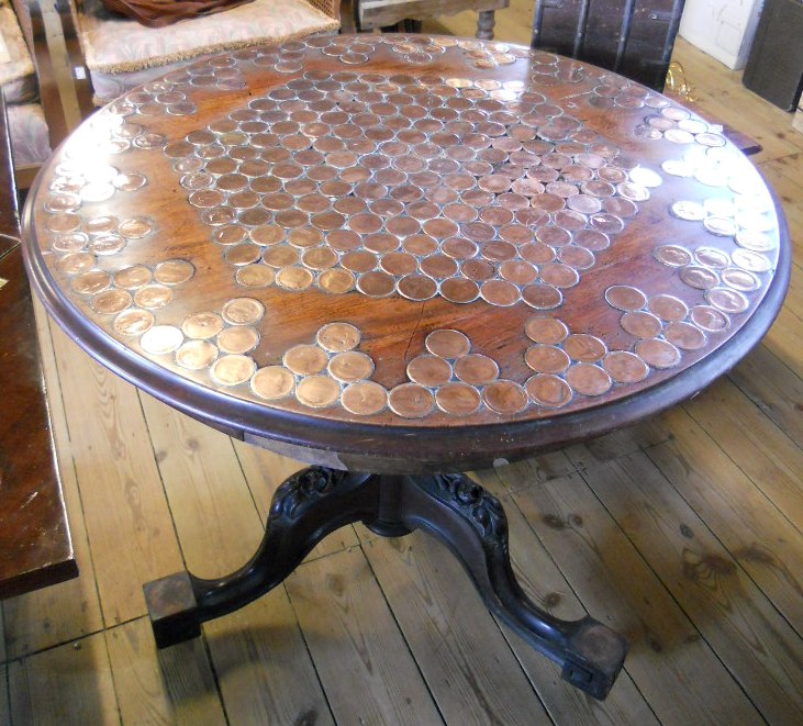 A late Georgian mahogany numismatist's collectors table, the top set with numerous 1797 cartwheel