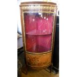 A 25" Italian gilt metal mounted walnut corner vitrine with material lined interior enclosed by a