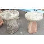 A pair of granite staddle stone tops and bases