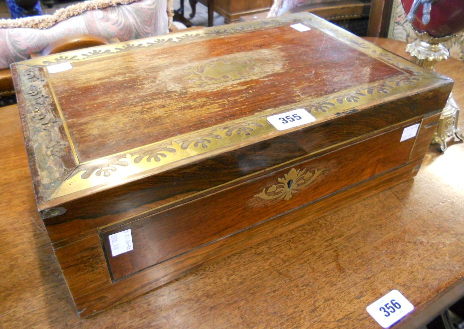 A 16" Regency brass inlaid rosewood writing slope with flanking flush brass handles and part