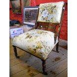 An Edwardian inlaid rosewood framed drawing room chair with decorative splat and upholstered seat