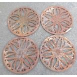 A set of four 21½" diameter Victorian cast iron circular floor ventilation grilles with pierced