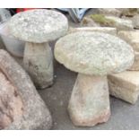 A pair of granite staddle stone tops and bases