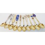 Nine Danish parcel gilt sterling silver Christmas Spoons with enamelled decoration by Anton