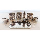 A set of 1930's Middle Eastern white metal table items, comprising six napkin rings and triple