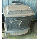 A 27" wide 1970s Vermont Castings Parlor Stove Vigilant log burner with two solid doors to bow front
