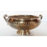 A 7" diameter Greek .925 silver footed bowl with embossed decoration and flanking acanthus scroll