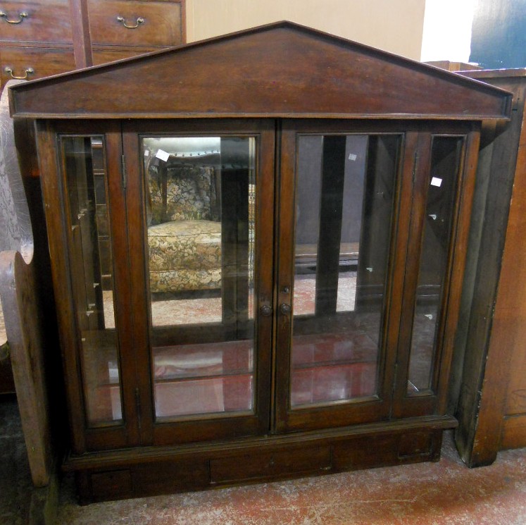 A 3' 3" late 19th Century continental mahogany counter top display cabinet with pitched roof, glazed